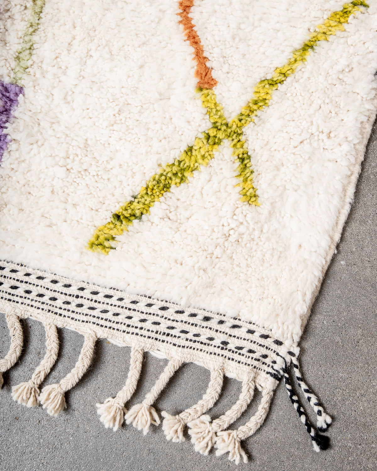 Modern, designer, handcrafted Berber rug from Morocco. Beniourain carpet with beautiful colours and patterns and fluffy wool texture.